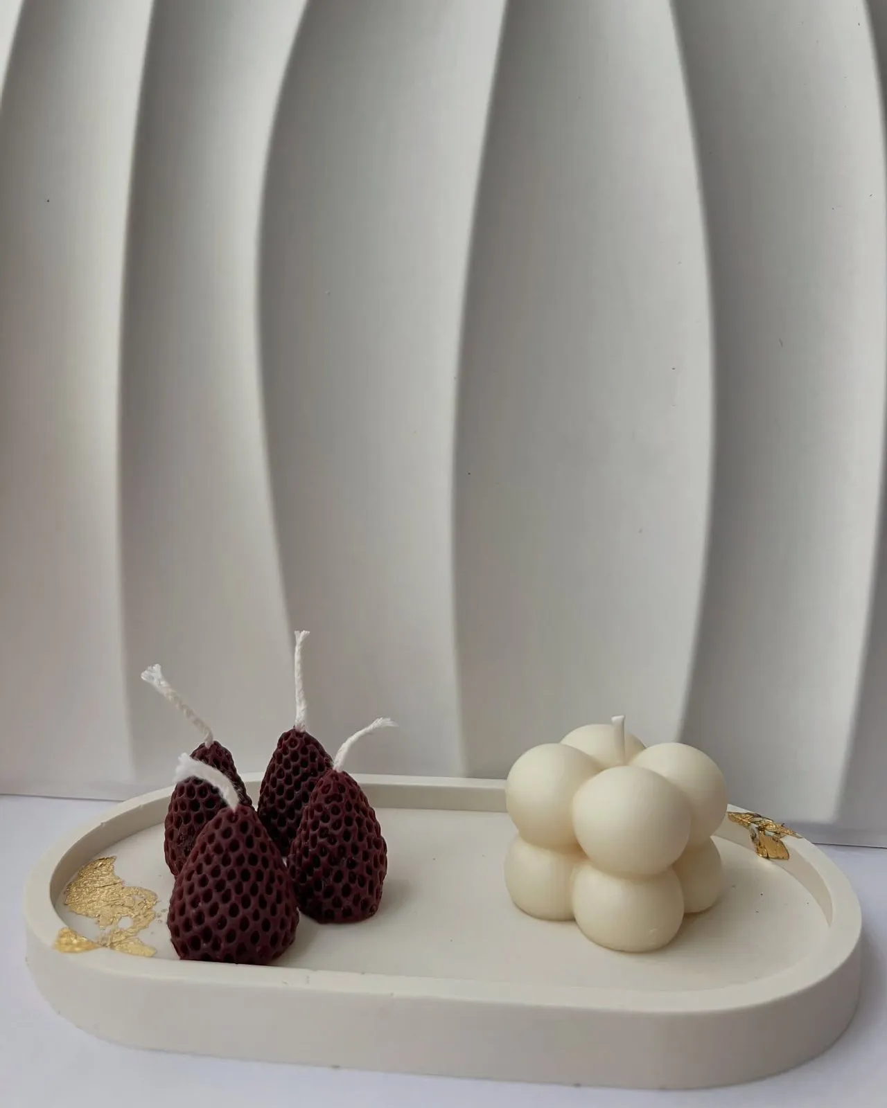 Strawberry and cube candles on a tray