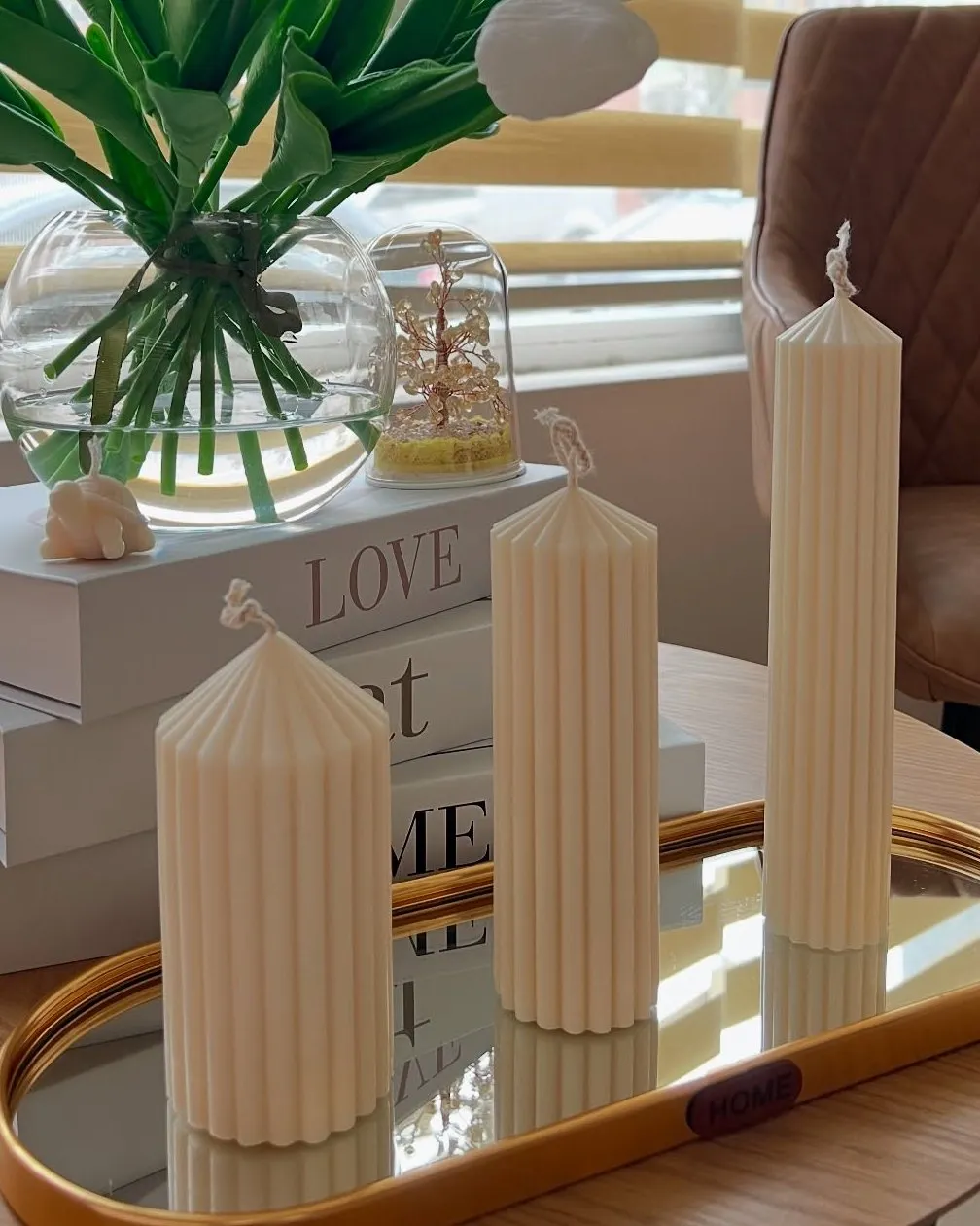 Three cream ribbed pillar candles